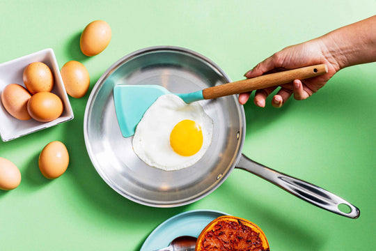 Fried Egg cooking on a stainless Steel Pan