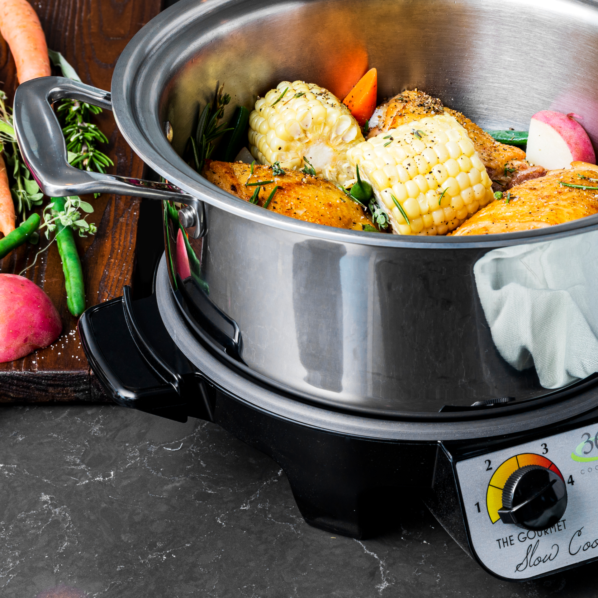 4-quart slow cooker with chicken, corn, and vegetables cooking inside