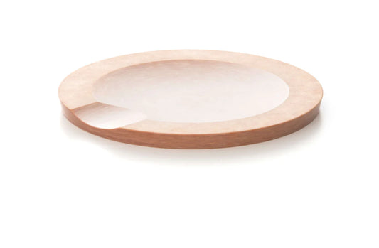 Natural round utensil rest made of wood, designed to keep counters clean.