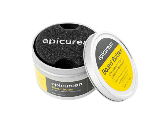 Open tin of Epicurean Board Butter with applicator, designed for cutting boards.