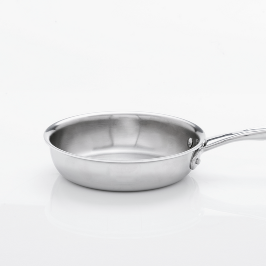 Stainless steel frying pan with long handle on white background.