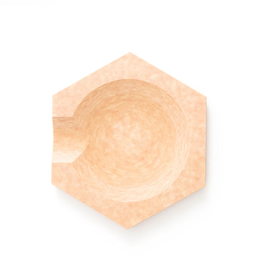 Natural hex tool rest for stylish countertop protection and cleanup.