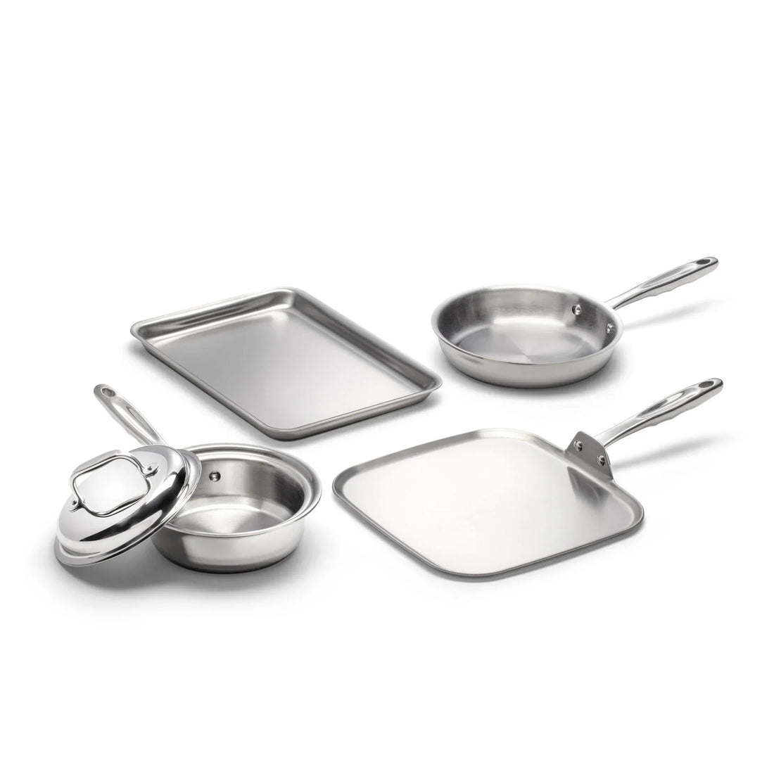 Four pieces of stainless steel cookware including a frying pan, a square pan, a round pot with a lid, and a baking sheet.