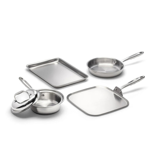 Four pieces of stainless steel cookware including a frying pan, a square pan, a round pot with a lid, and a baking sheet.