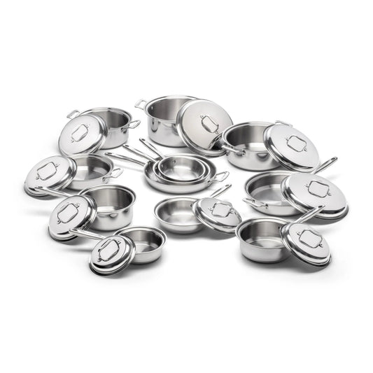 A collection of stainless steel cookware including pots and lids arranged together.