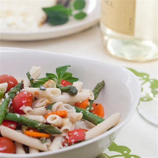 Bowl of Mezze Penne Pasta Primavera with tomatoes, asparagus, and carrots
