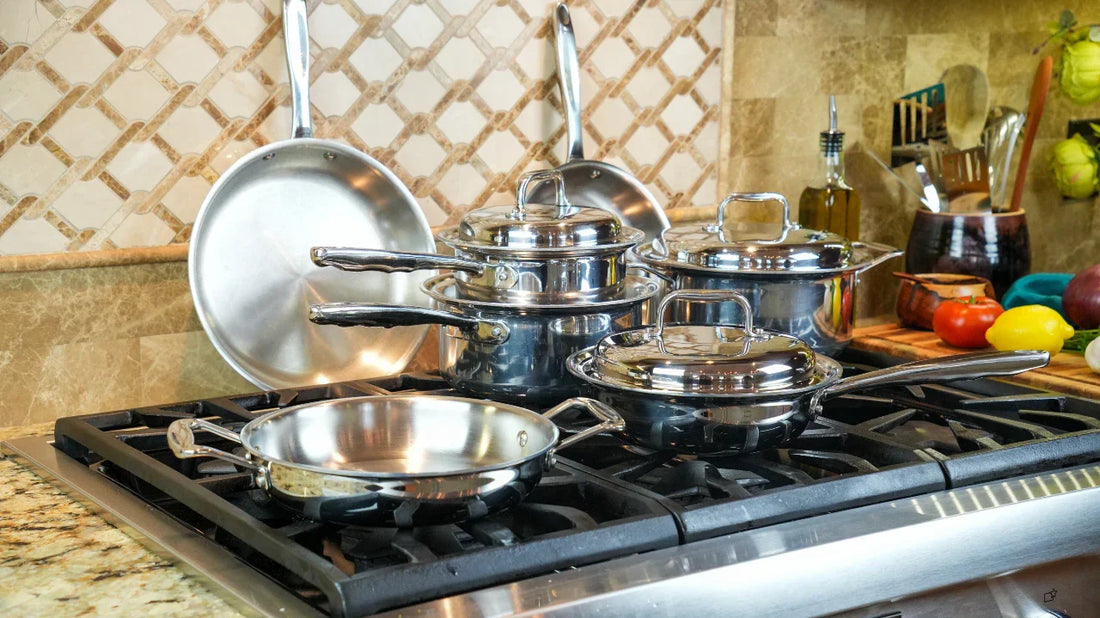 stainless steel cookware set on a stove top