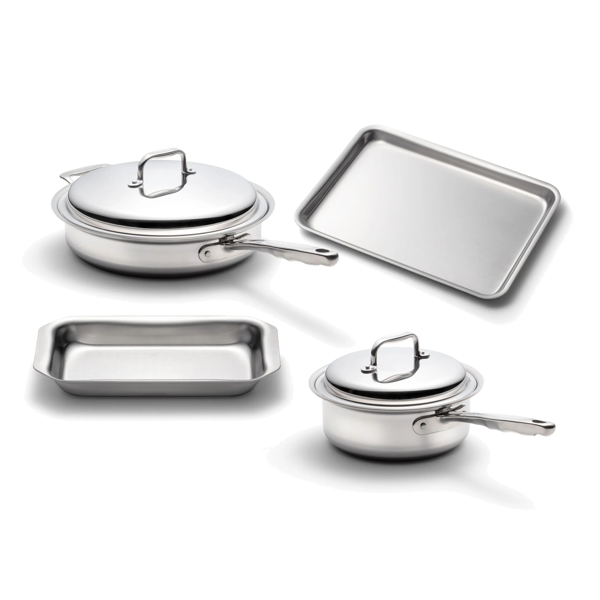 Four stainless steel cookware pieces including a covered pot, a baking tray, and a rectangular dish.