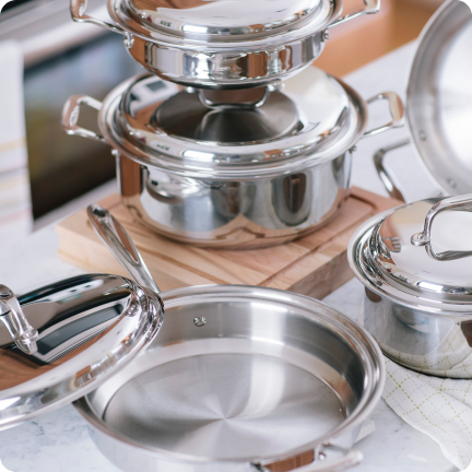 Stainless Steel Pots and Pans on a table in the kitchen