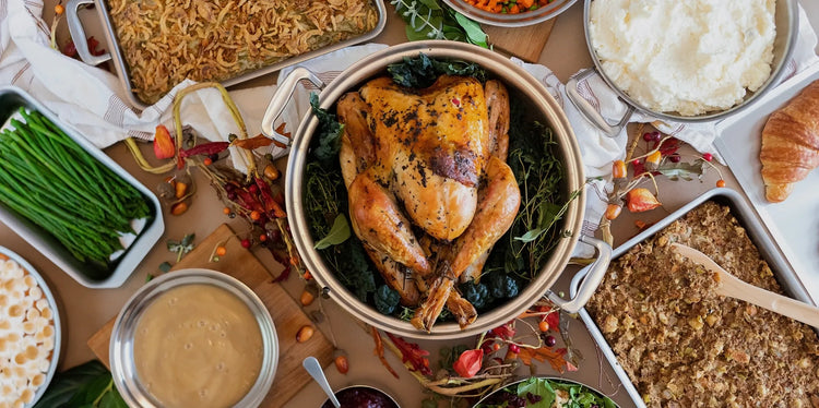 Roasted turkey with sides on a wooden table