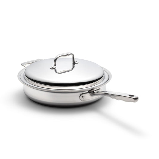 Stainless-steel sauté pan with lid and long handle, angled on white background.