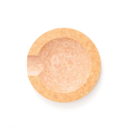 Round natural color utensil rest with a hexagonal shape