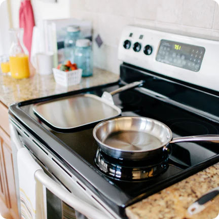360 Cookware Stainless Steel pans on an electric stove
