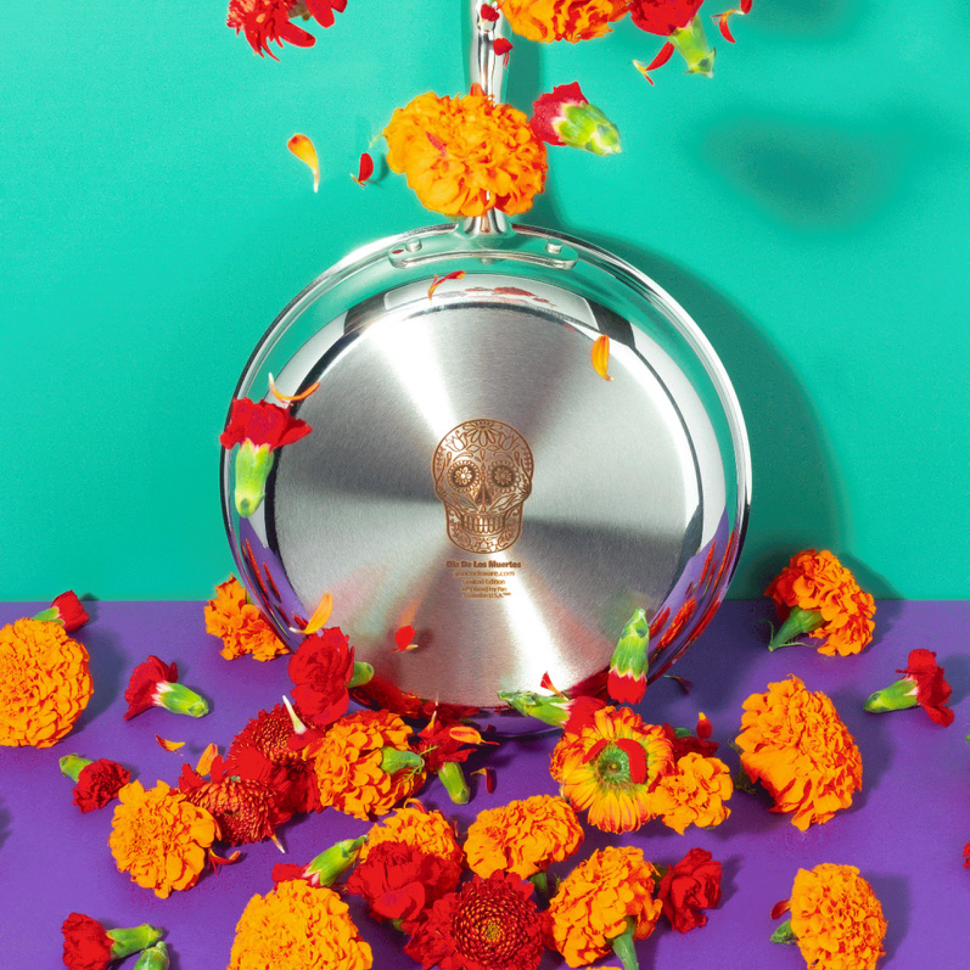 10-inch stainless steel fry pan with Dia De Los Muertos design surrounded by marigolds and petals