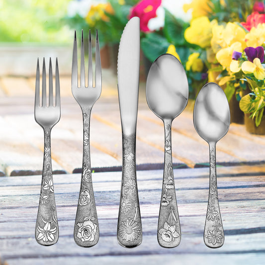 Five-piece utensil set with floral designs on handles