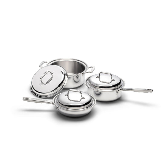 Three stainless steel saucepans with lids, including a sauté pan and two saucepans.