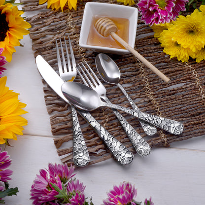 Honey Bee 65 Piece Flatware Set displayed with honey and flowers