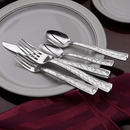 Weave 45 Piece Set flatware with distinctive basket design on a plate